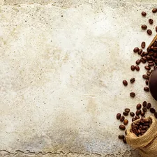Top view mockup coffee beans on light stone. White paper sheet copy space with vignette related to Coffee Themed Valances