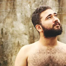 topless man near beige wall related to What Men Really Mean by 'What Do Men Want in Bed'?