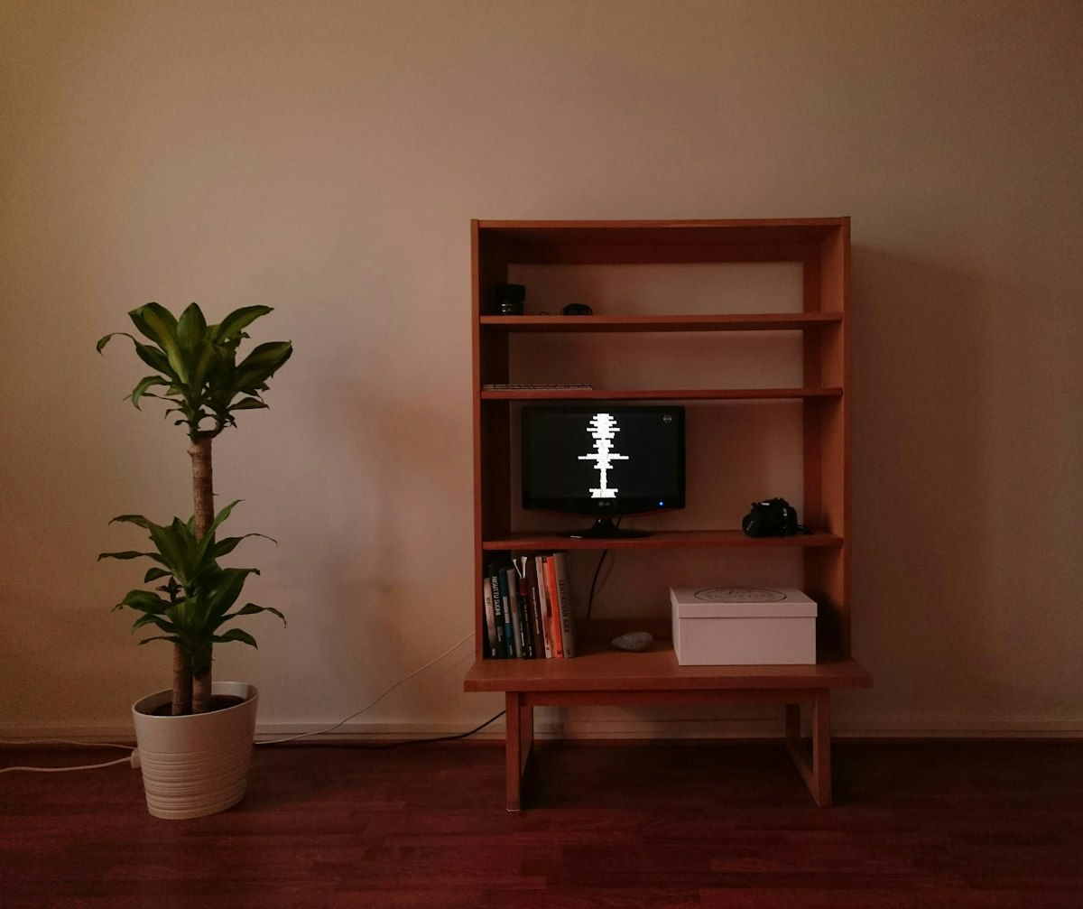 turned-on monitor in a wooden hutch related to Modern Storage Solutions: Cherry Server Sideboard