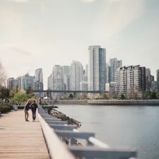 two women walking on brown dock near body of water related to Exploring the Charm of Vancouver's Bed and Breakfasts