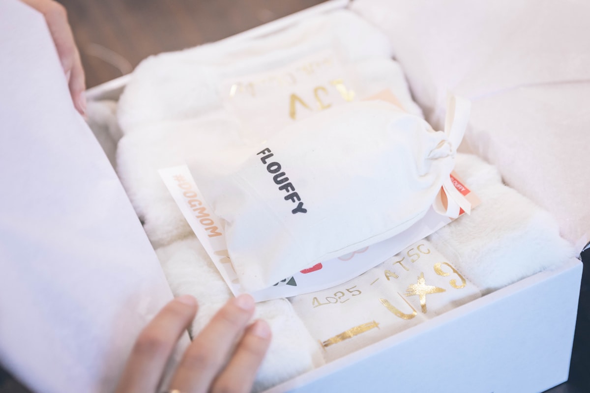 Unboxing present gift box for dog mom related to Treasured Essentials: Gold Nursery Bedding for the Little One