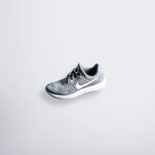 unpaired gray and white Nike Flyknit shoe related to Maximizing Space: Innovative Shoe Storage Solutions for Small Entryways