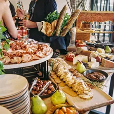 variety of food displayed on a table related to The Ultimate Showdown: Sideboard vs Buffet