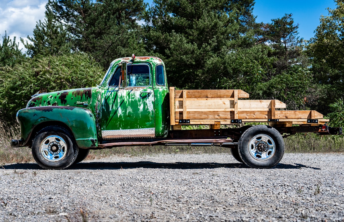 vintage green truck in need of a paint job related to Building Your Own Wood Truck Bed: A Comprehensive Guide