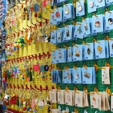 Wall display of colorful keychains and trinkets related to Exploring the Charm of Toy Story Valances: A Unique Home Decor Solution