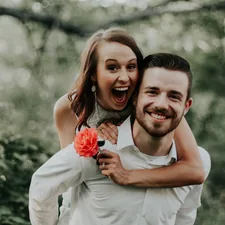 We were walking through a park with trails leading into the forests, when we saw this breathtaking coral flower… my sister ran and got it and jumped on her husbands back… right then and there is where is captured this priceless image. related to The Art of Romantic Intimacy: A Guide to Winning a Woman's Heart in Bed