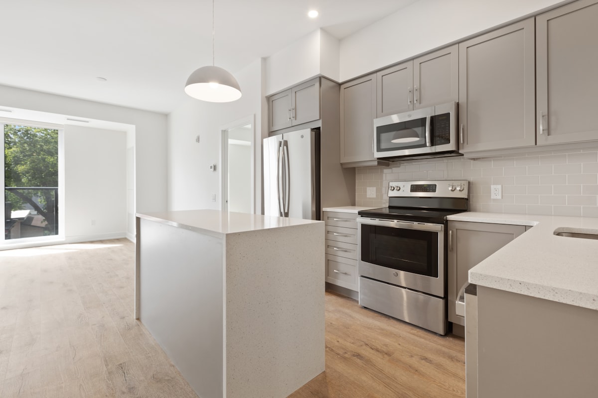 white and black kitchen cabinet related to Your Dream Condo Awaits: Spacious 2 Bed 2 Bath Gem