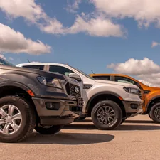 white and black suv on gray asphalt road under blue and white sunny cloudy sky during related to Ford Ranger Front Valance