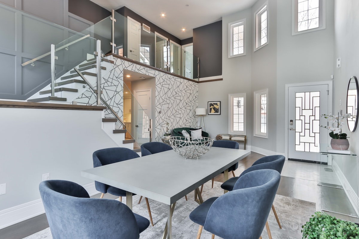 white and black wooden table with chairs related to Elevate Your Home with Luxurious Silk Valances