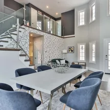 white and black wooden table with chairs related to Elevate Your Home with Luxurious Silk Valances