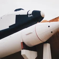 white and brown space ship related to Blast Off to Dreamland: The Ultimate Guide to Rocket Ship Bedding