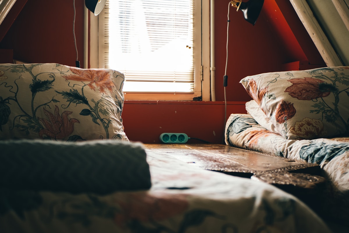 white and red floral throw pillow on white and red floral sofa related to Twin Bed Coverlets