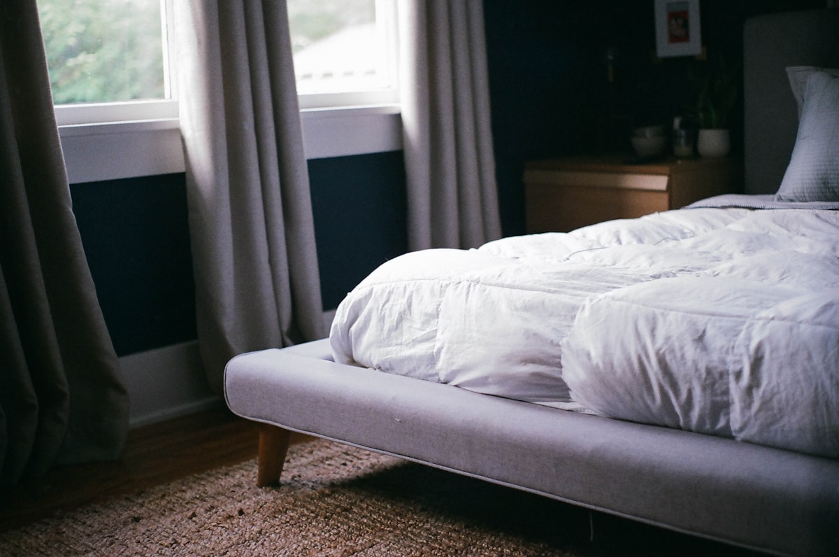 white bed by the window during daytime related to Platform Bed Coverlet
