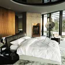 white bed linen near black table lamp related to The Rise of the Disc O Bed: A Sleeping Revolution