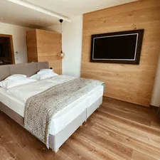 white bed linen on bed related to The Ultimate Sleep and Entertainment Experience: Beds with TVs