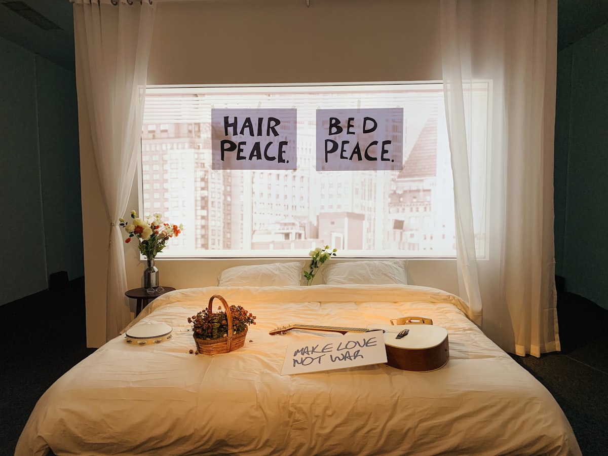 white bed linen with brown wooden table and chairs related to Rise and Shine: The Story of Bed Head Resurrection