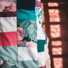 white blue and red textile related to Understanding the Difference: Quilt vs Coverlet