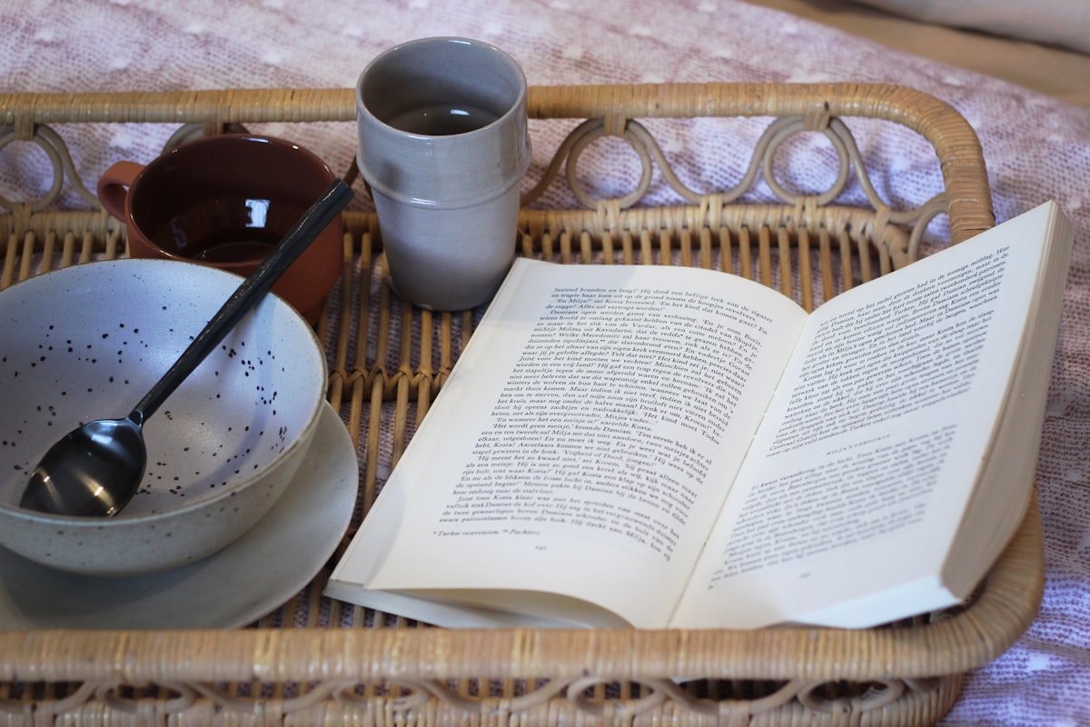 white book on brown wicker tray related to The Charm of Bed & Breakfast: A Cozy Getaway