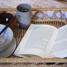 white book on brown wicker tray related to The Charm of Bed & Breakfast: A Cozy Getaway