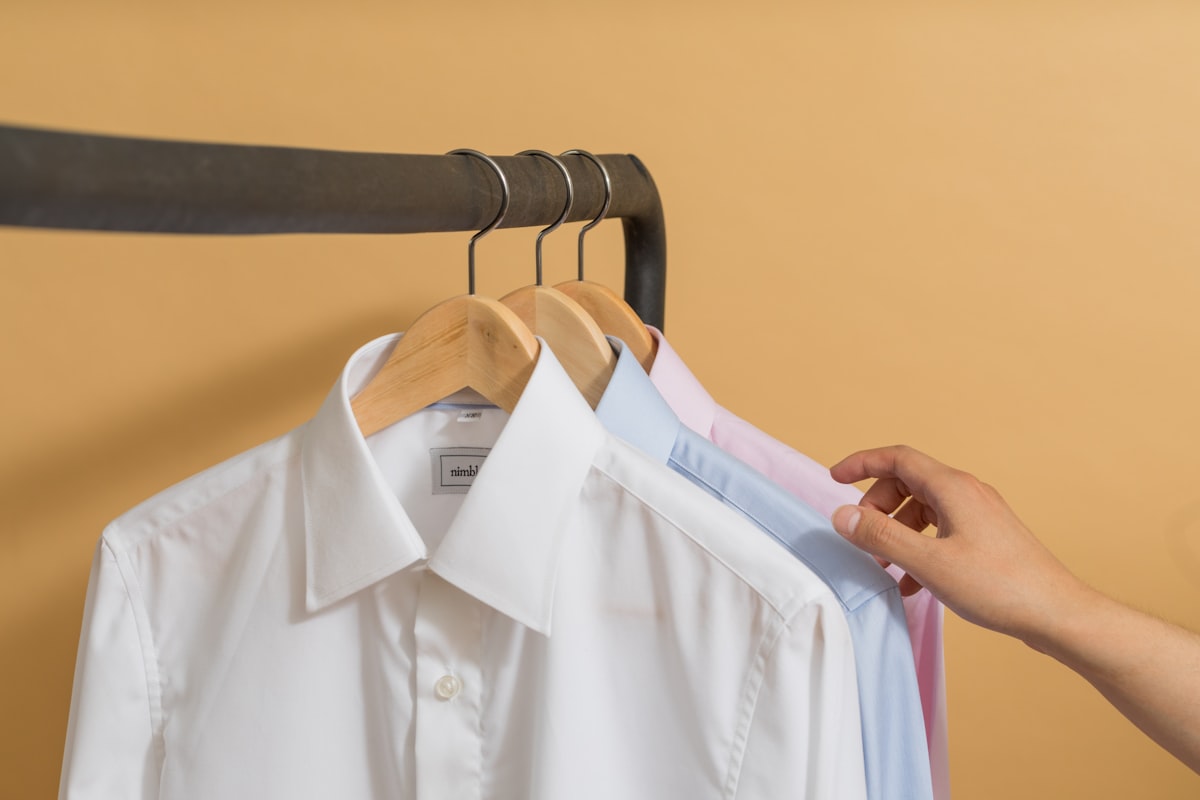 white button up shirt on black clothes hanger related to Securely Hang Your Valances with Reliable Replacement Clips