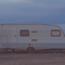 white camper trailer on desert related to Exploring the Best Travel Trailers with Bunk Beds