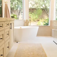 white ceramic bathtub near white wooden cabinet related to Elevate Your Bathroom Style with Shower Curtains featuring Valances