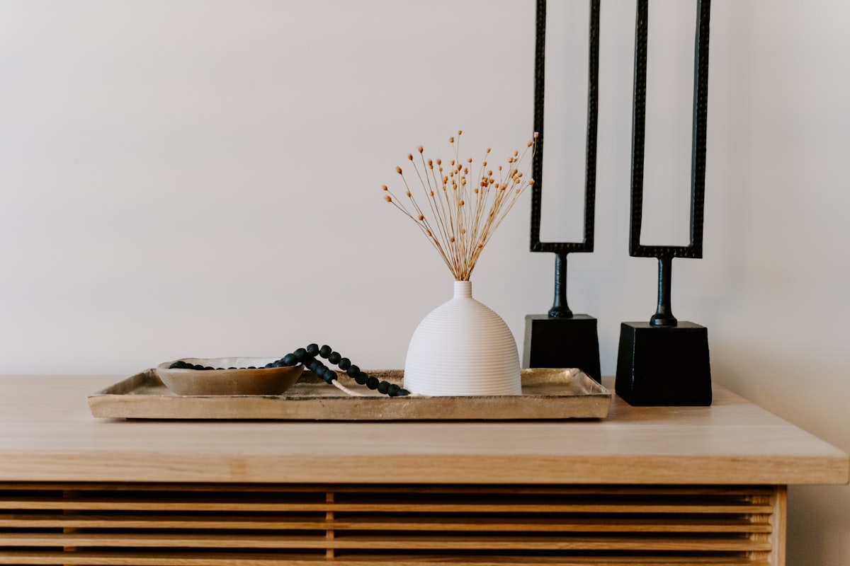 white ceramic vase near two black table decors related to Elevate Your Home Decor with the Trendy Swag Valance Pattern