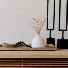 white ceramic vase near two black table decors related to Elevate Your Home Decor with the Trendy Swag Valance Pattern