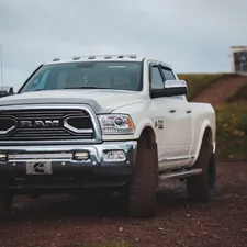 white chevrolet single cab pickup truck related to Ultimate Guide to Bed Covers for the 2014 Ram 1500