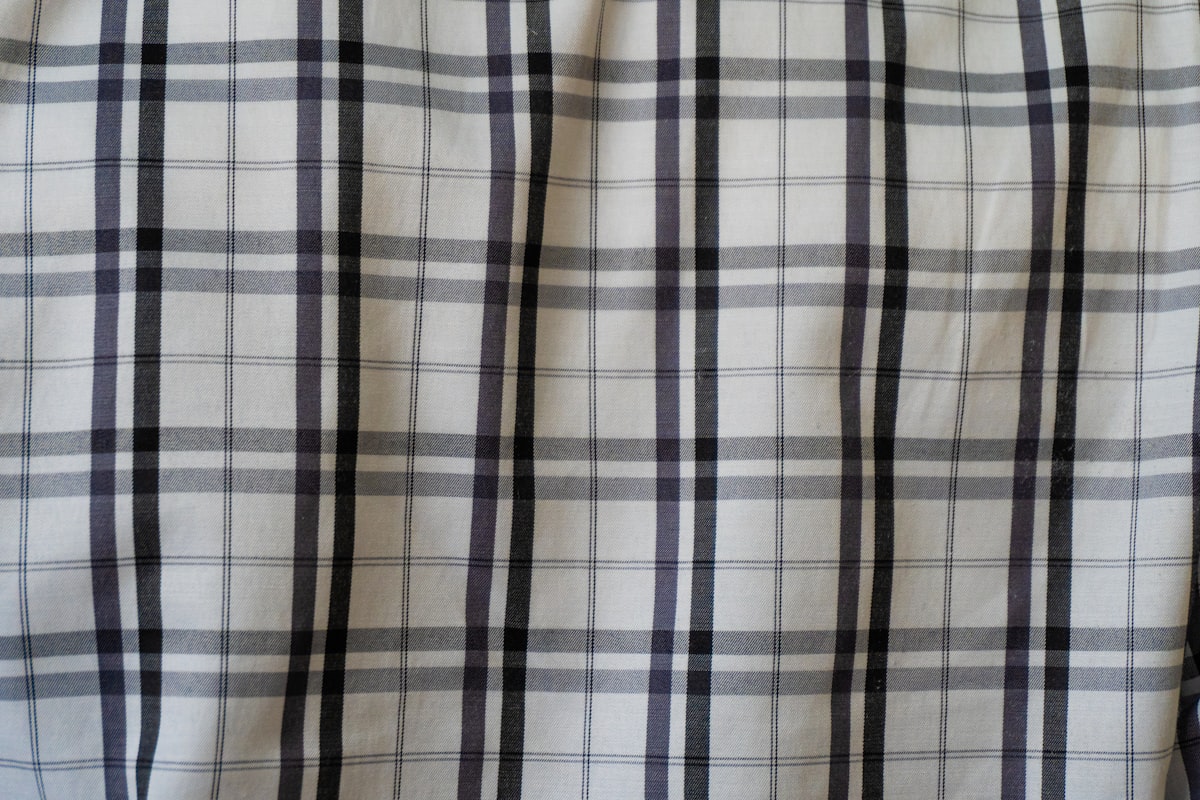 White fabric with a black and gray plaid pattern related to Plaid Kitchen Curtains Valances