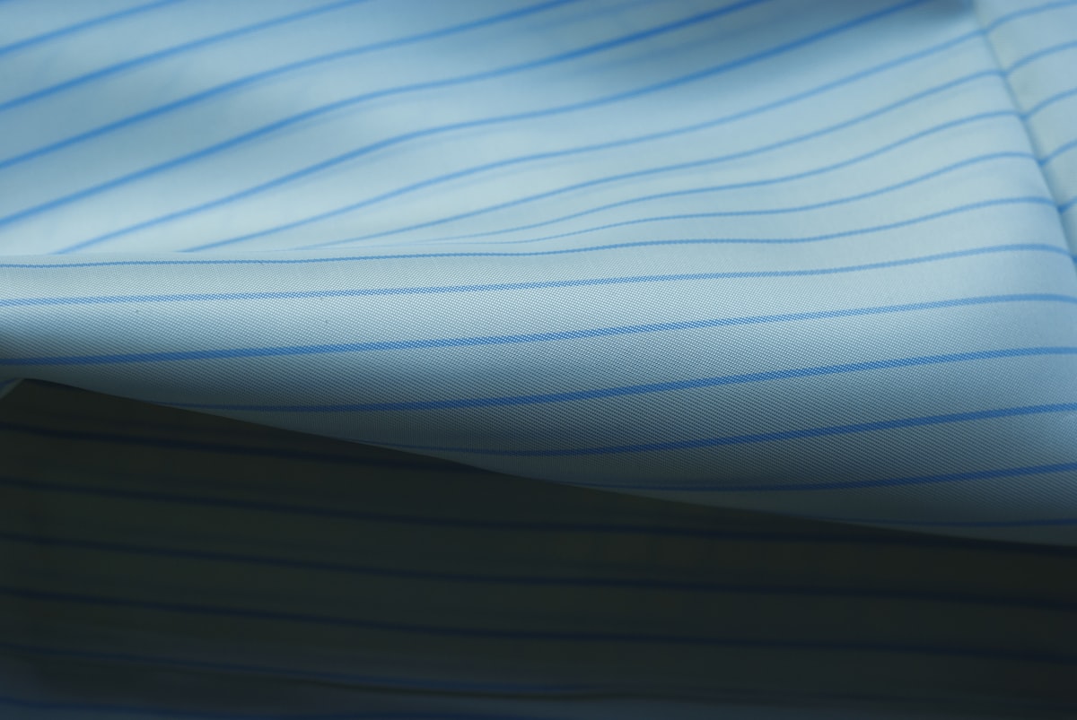 White fabric with blue stripes related to Blue Stripe Valance Ideas to Elevate Your Decor