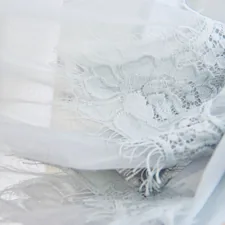 white floral textile on brown wooden table related to Sheer Scarf Valance