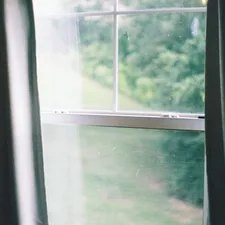 white framed glass window during daytime related to Elevate Your Window Dressing Game with Swag Curtain Valances