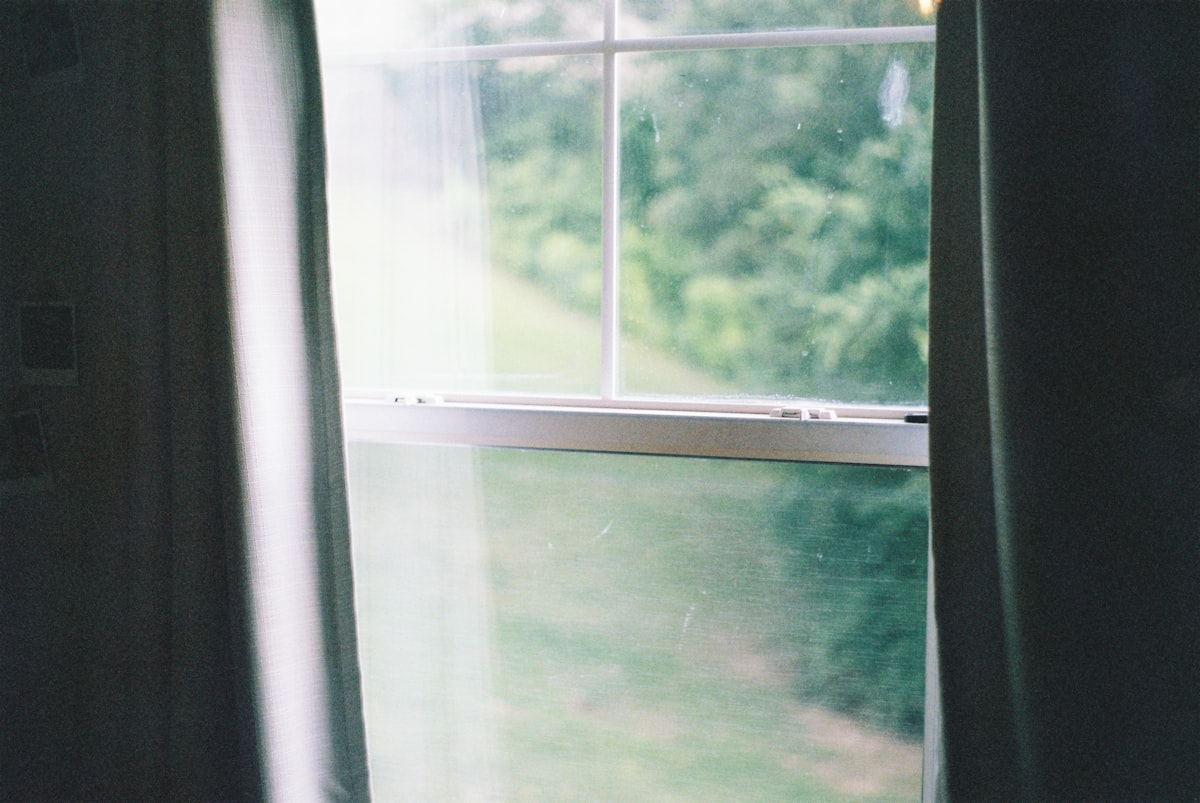 white framed glass window during daytime related to Elevate Your Window Dressing: Horizontal Blinds Valance Clips