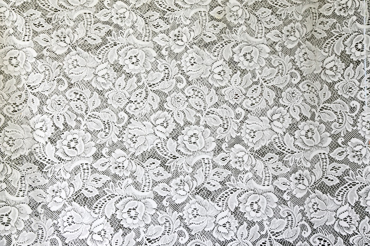 White lace like this used to be popular for tablecloths on special occasions. related to Elegant Touch of White Lace: Exploring the Beauty of White Lace Window Valances