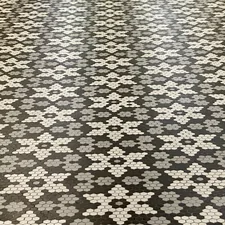 White marble honeycomb floor tiles in a flower pattern. related to Transform Your Entryway with the Perfect Floor Tile