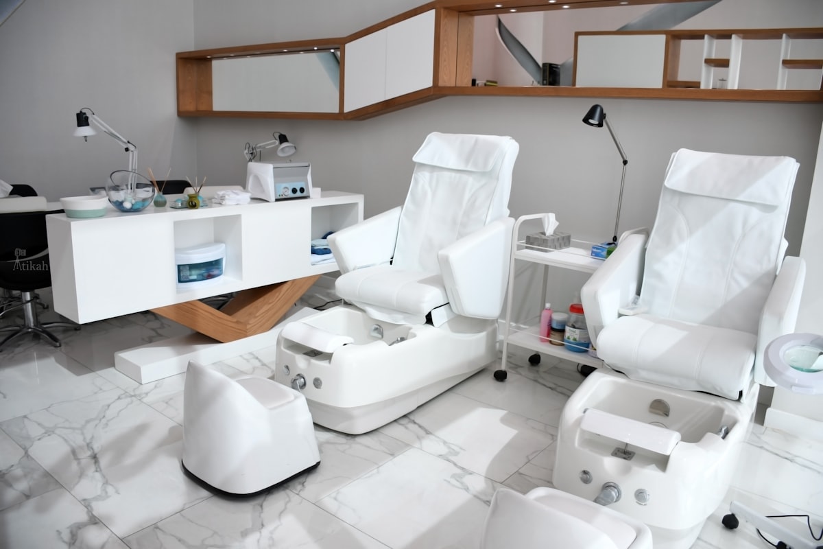 white rolling chairs near brown wooden desk related to Effective Solutions for Nail Bed Restoration