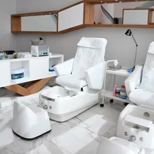 white rolling chairs near brown wooden desk related to Effective Solutions for Nail Bed Restoration