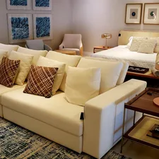 white sofa chair near white table lamp related to Elevate Your Living Space: The Ultimate Guide to Bed Bath and Beyond Sofa Covers