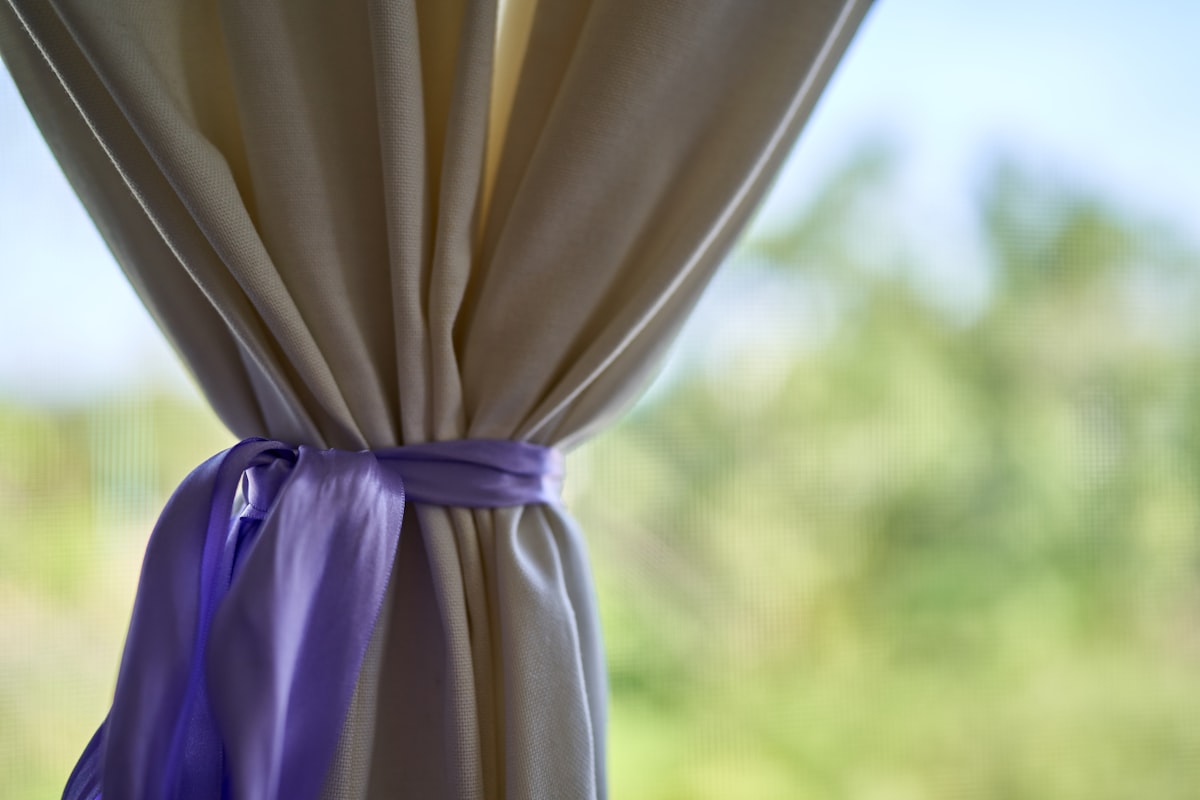 white textile near green grass during daytime related to DIY Curtain Valances: A Step-by-Step Guide