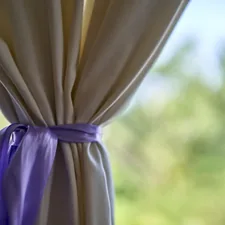 white textile near green grass during daytime related to DIY Curtain Valances: A Step-by-Step Guide