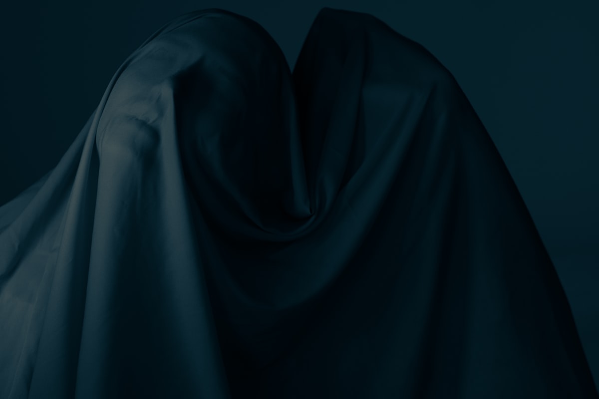 white textile on blue background related to Draped in Darkness: The Majestic Dark Purple Valance