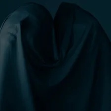 white textile on blue background related to Draped in Darkness: The Majestic Dark Purple Valance