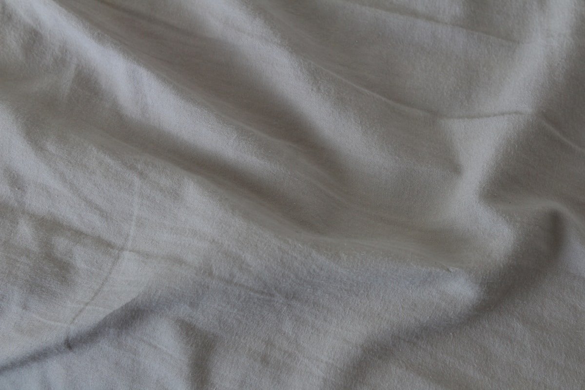 white textile on blue textile related to Light Grey Coverlets