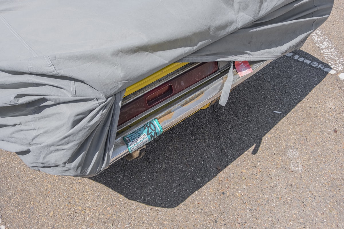 white textile on brown and gray concrete floor related to Crate and Barrel Coverlet