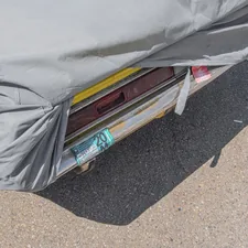 white textile on brown and gray concrete floor related to Crate and Barrel Coverlet