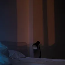 white textile on white bed related to Maximize Your Comfort: The Ultimate Guide to Clip-On Bed Lamps