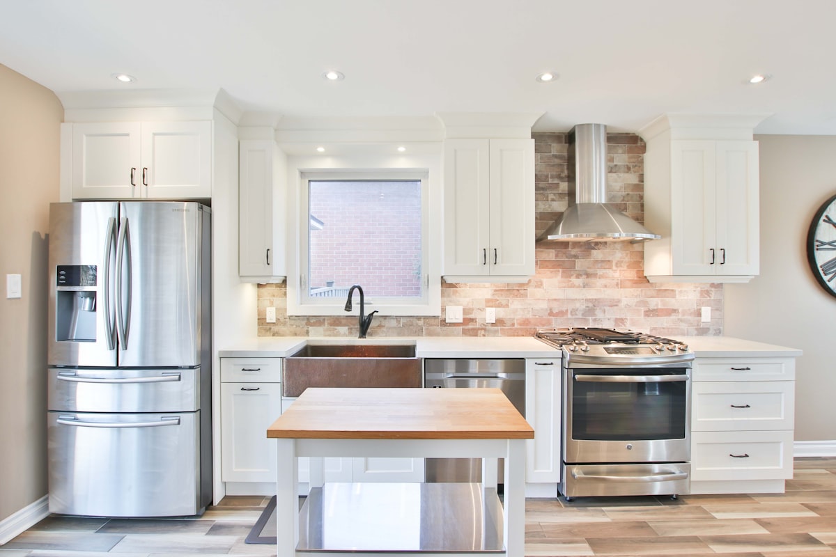 white top mount refrigerator beside white wooden kitchen cabinet related to Affordable Kitchen Valances