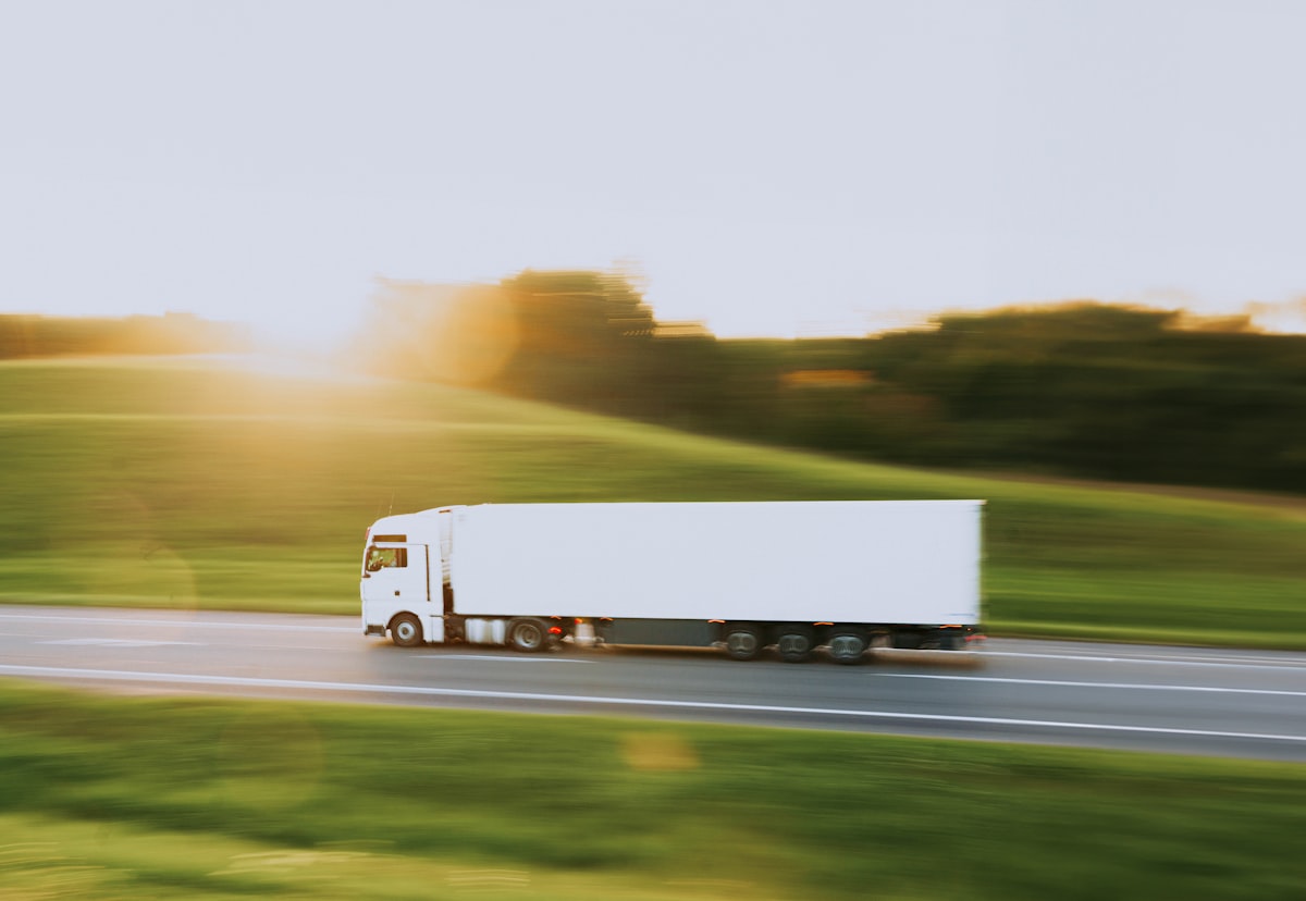 white truck in motion blur at sunset // белая фура в движении на закате related to Maximizing Your Truck's Potential: The Benefits of a Thule Truck Bed Rack