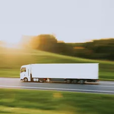 white truck in motion blur at sunset // белая фура в движении на закате related to Maximizing Your Truck's Potential: The Benefits of a Thule Truck Bed Rack